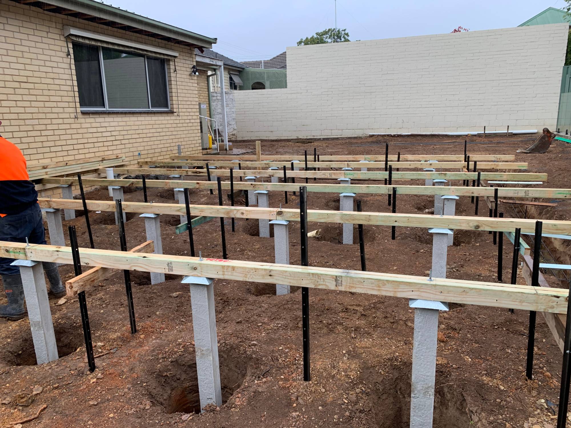 Extension under construction with concrete stumps and bearers in place